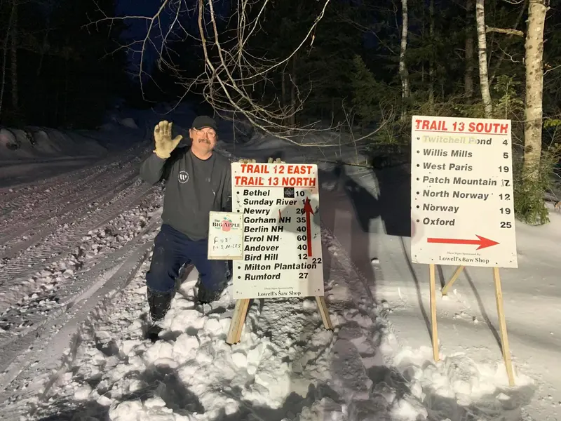 Trail signs showing distances to Bethel, Sunday River, Gorham NH, and other destinations from the Greenstock trail network
